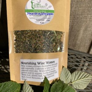 a bag of nourishing wise woman blend tea on a table with tea leaves