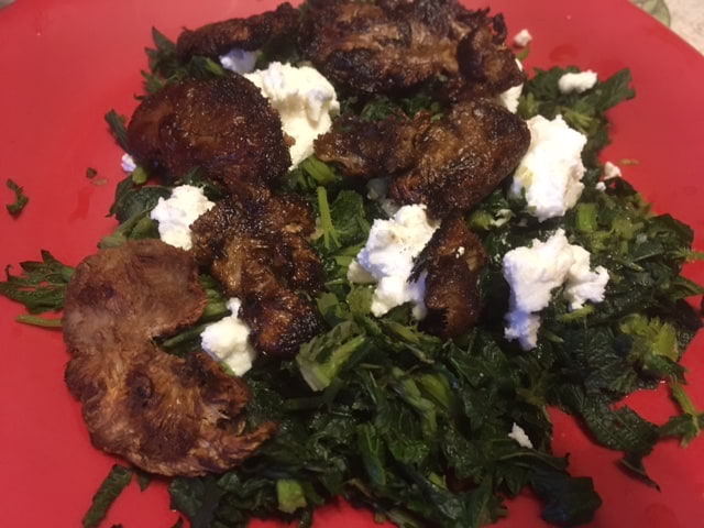 Steamed Nettle tips with sauteed Lion's Mane mushrooms; topped with fresh Garlic Olive oil and Goat cheese